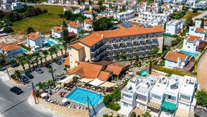 A hotel with a rooftop pool, multiple balconies, and a modern architectural style. - Anais Bay Hotel (Paralimni)