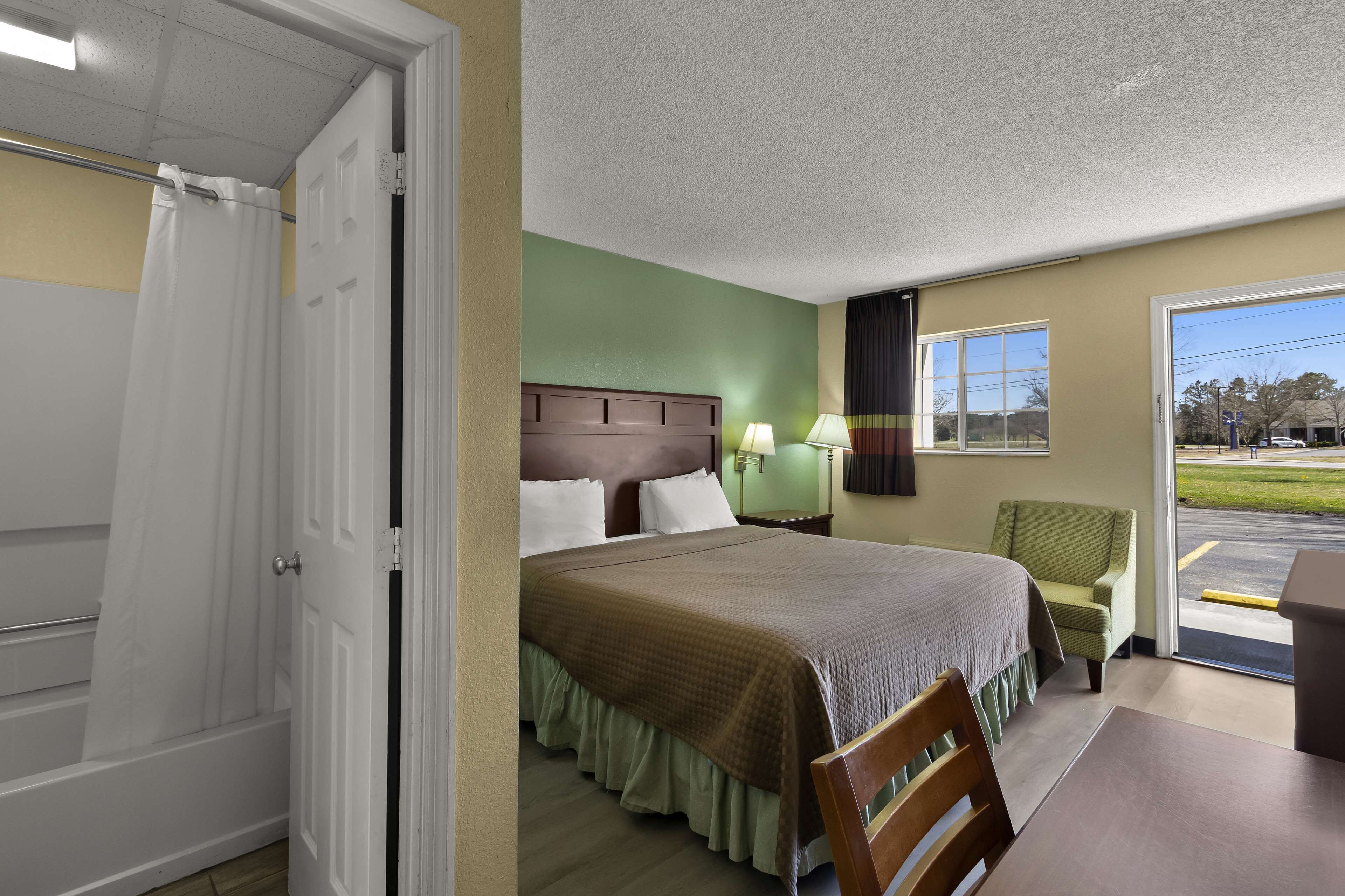 Premium bedding, desk, blackout curtains, iron/ironing board