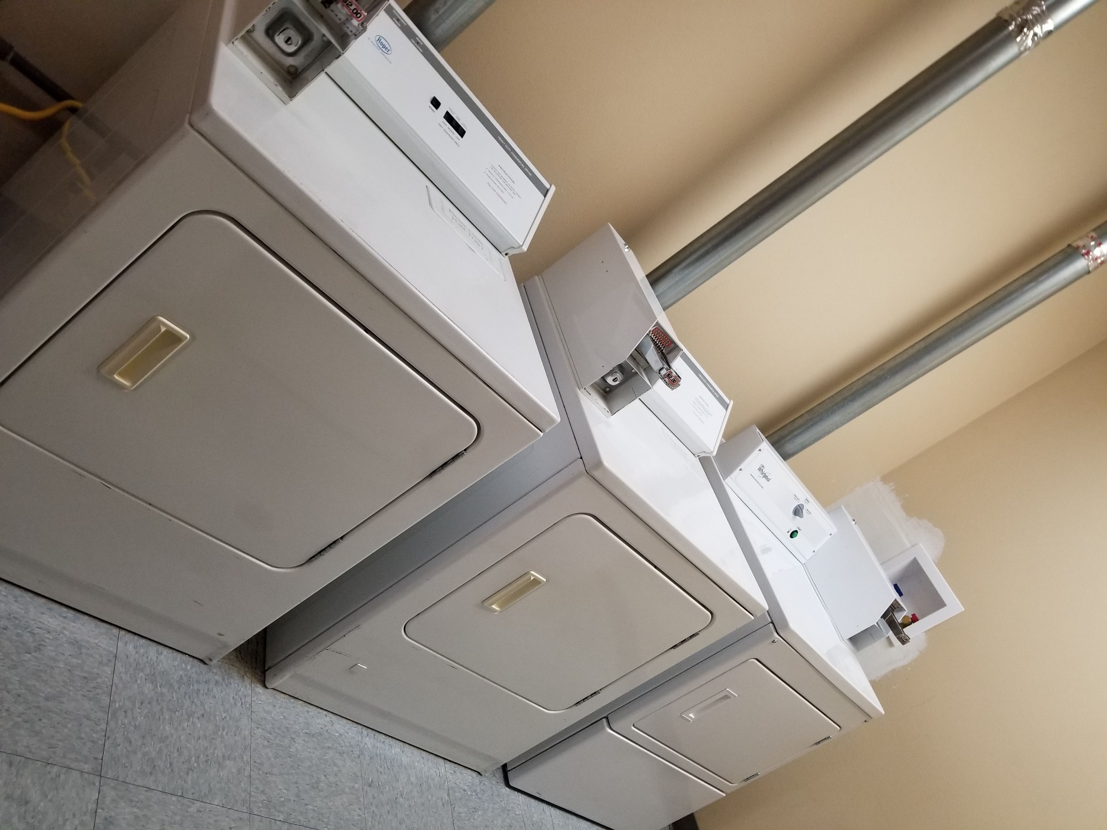 A row of white, industrial-style electrical panels with ventilation grilles and control knobs.