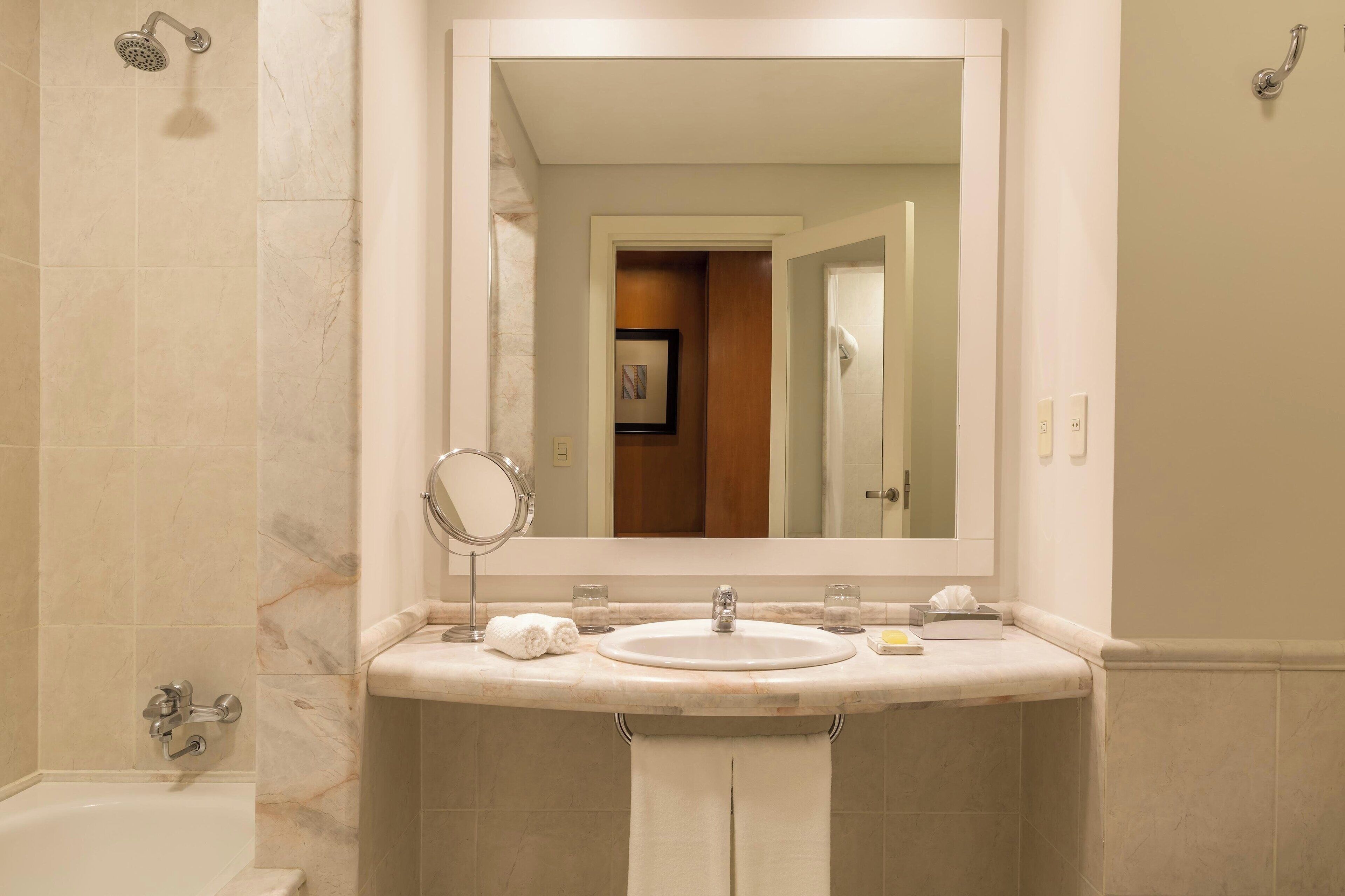 classic room, 1 king bed, non smoking, city view | bathroom | shower, rainfall showerhead, free toiletries, hair dryer