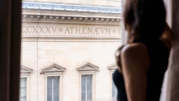 A view of a building facade with the inscription "C.CXXV ATHENEVM".