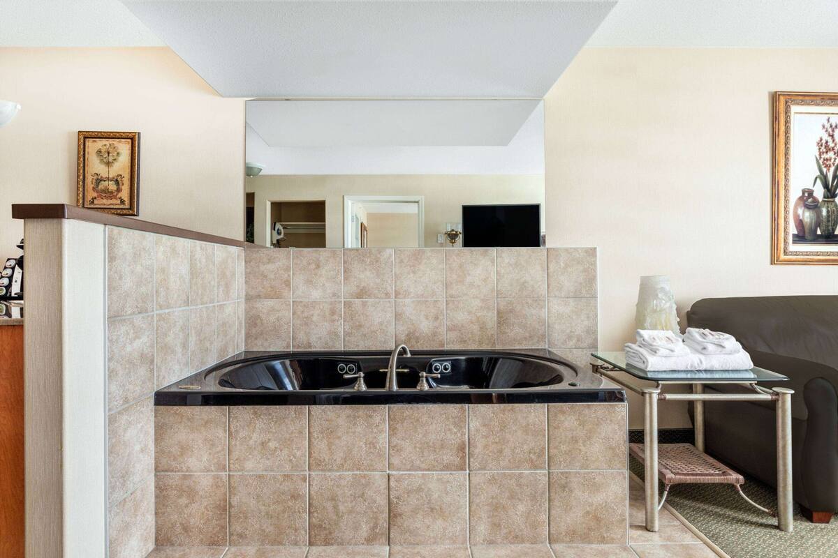 premium bedding, desk, laptop workspace, blackout curtains