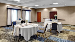 A conference room with round tables, chairs, and a carpeted floor. - Holiday Inn Express Hotel & Suites Richmond North Ashland by IHG (Ashland)