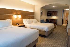 A hotel room with two beds, a nightstand, a desk, a chair, a microwave, and a kitchenette. - Holiday Inn Express & Suites Elkhart by IHG (Elkhart)