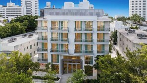 A multi-story hotel with a modern architectural design, featuring balconies and large windows. - Sanctuary South Beach (MIAMI BEACH)