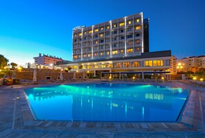 Indoor pool, seasonal outdoor pool, pool umbrellas, pool loungers