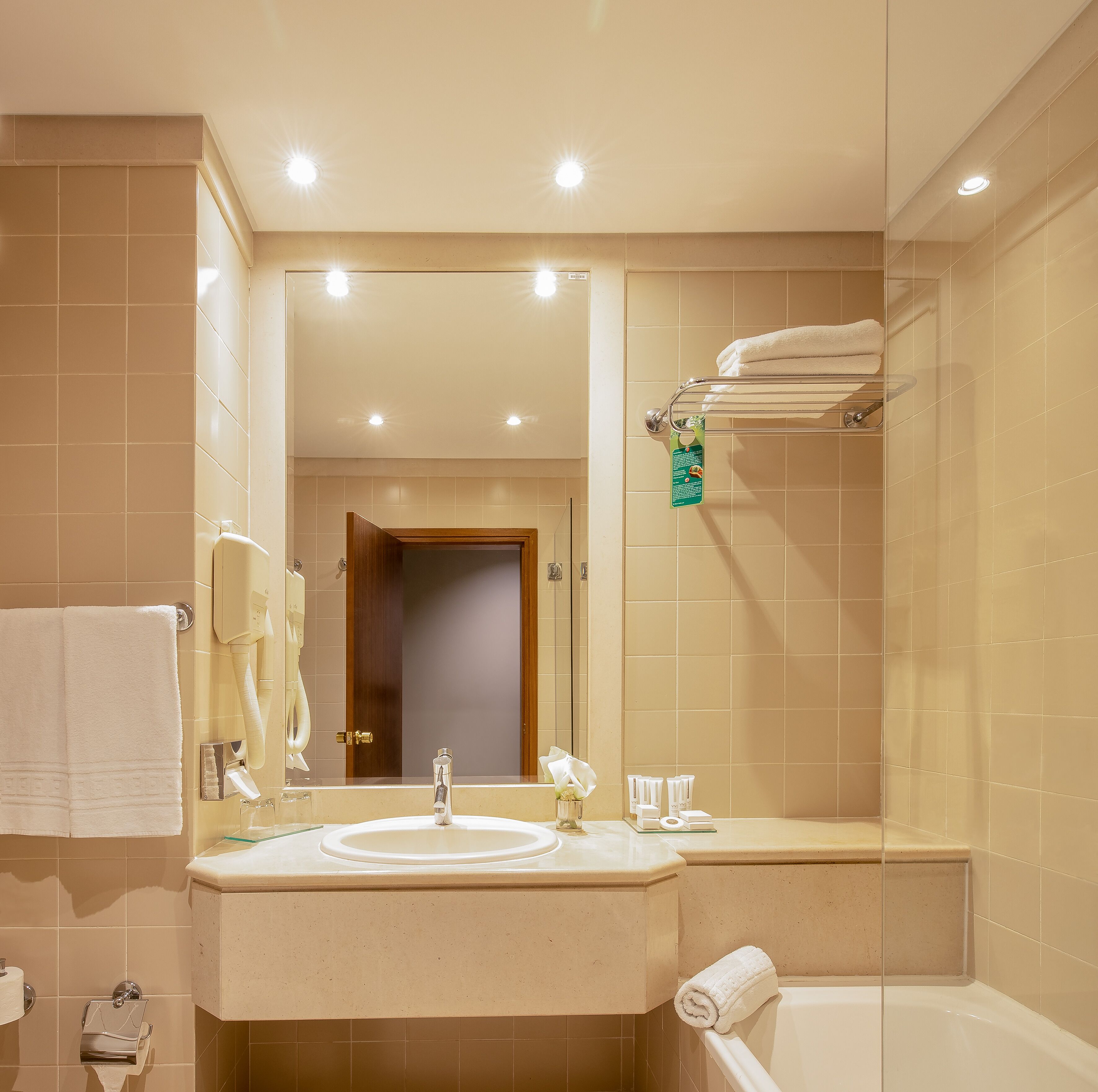 deep-soaking bathtub, rainfall showerhead, free toiletries, hair dryer