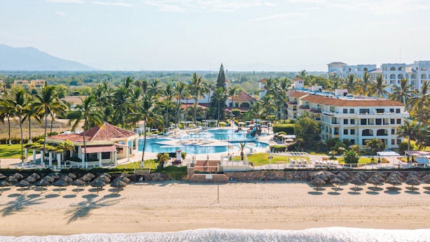 A resort with a swimming pool, beach, and palm trees. - Samba Vallarta - All Inclusive (Nuevo Nayarit)