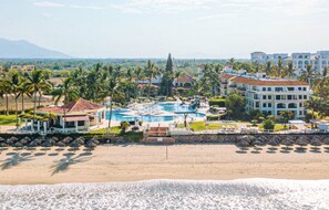 A resort with a swimming pool, beach, and palm trees. - Samba Vallarta - All Inclusive (Nuevo Nayarit)