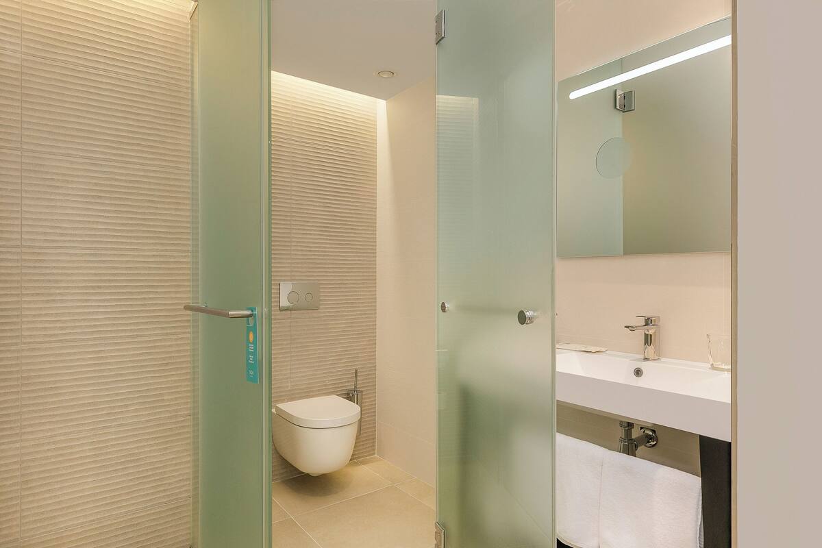 shower, eco-friendly toiletries, hair dryer, towels