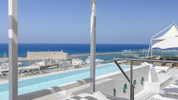 Seasonal outdoor pool, open 8:00 AM to 7:00 PM, pool umbrellas