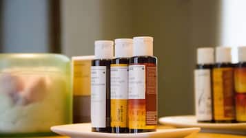 A collection of essential oil bottles on a white tray.