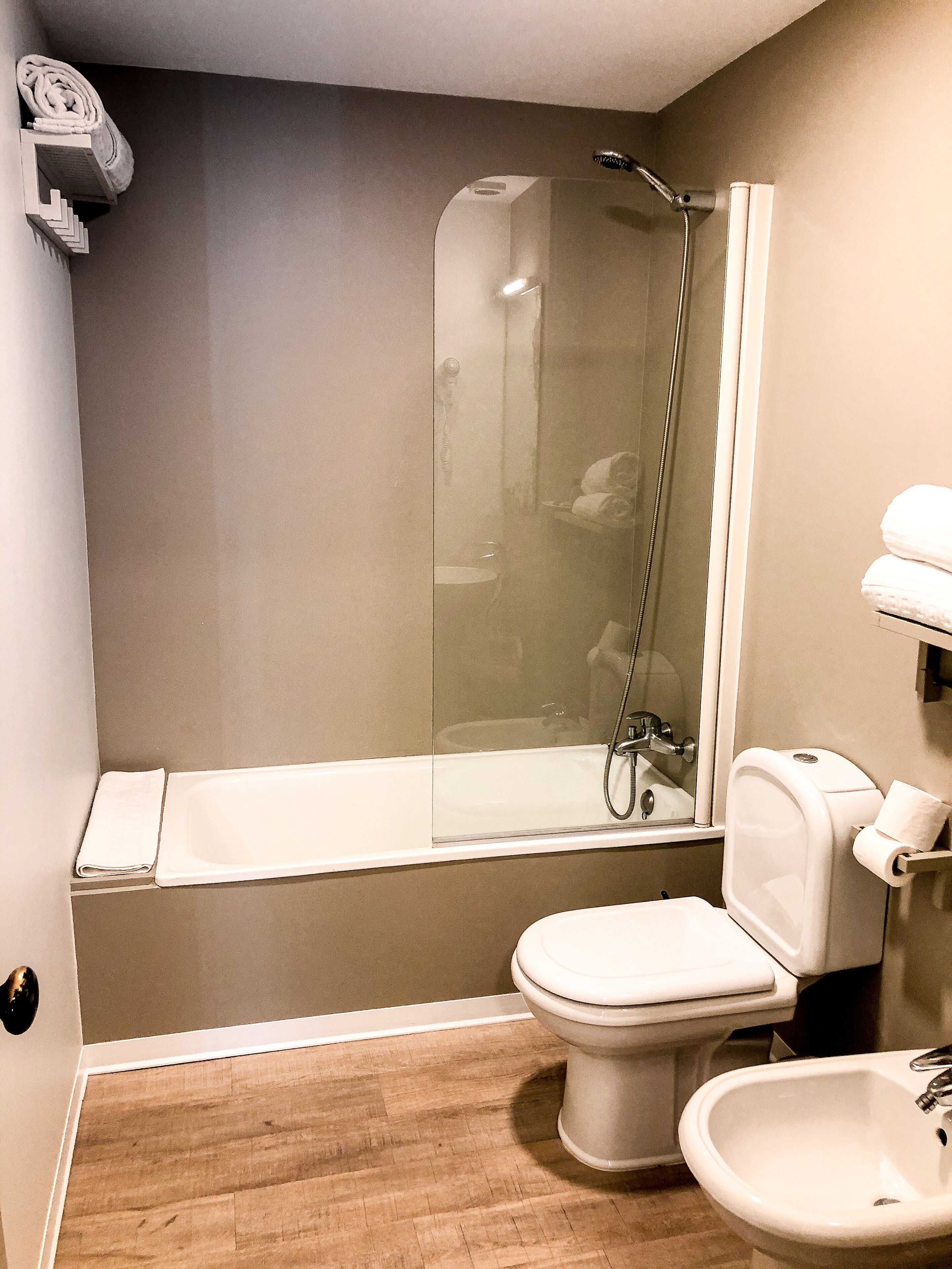 junior suite | bathroom | shower, hair dryer, towels, soap