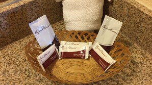 A tray with three RainBreeze® Gentle Cleansing Face & Body Bar products on a granite countertop. - Turtle Bay Lodge (Redding)