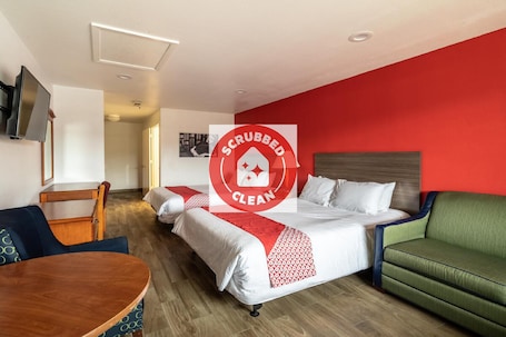 Desk, bed sheets, alarm clocks. OYO Hotel San Antonio near AT&T Center