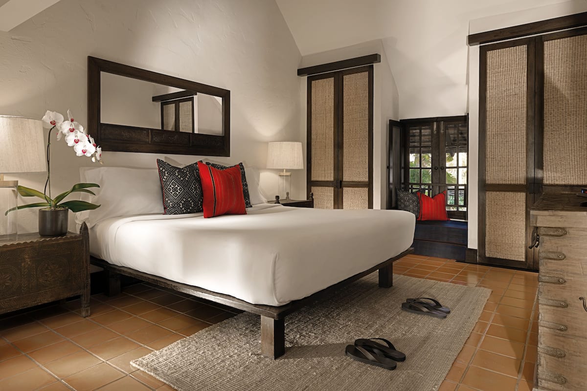 Lanna Suite | Minibar, in-room safe, individually decorated, desk