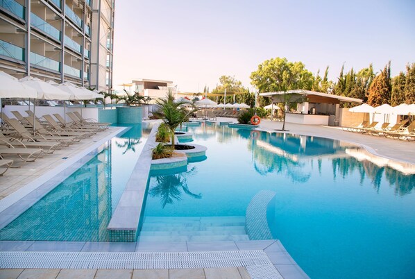 Indoor pool, seasonal outdoor pool, pool umbrellas, pool loungers