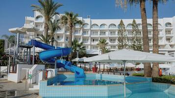 Relax by the pool surrounded by lush greenery and enjoy a refreshing swim.