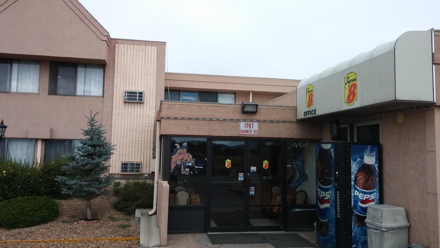 A bank with a large sign reading "Super 8 Office" and a visible address "1987 BANNER RD".