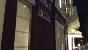 The exterior of the Vittoria Hotel with a prominent sign, a large window, and a visible entrance. - Vittoria Hotel (Rubano)