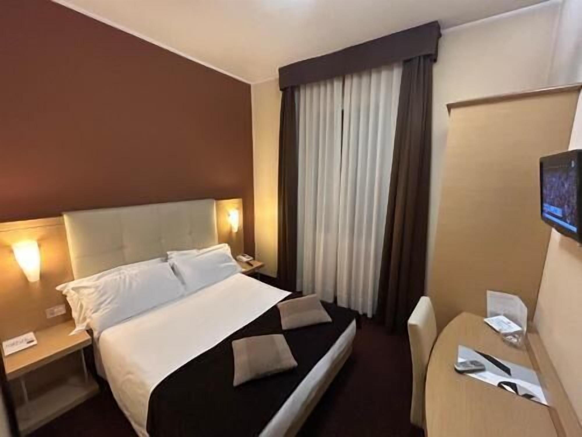 Hypo-allergenic bedding, down comforters, minibar, in-room safe