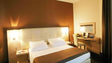Hypo-allergenic bedding, down comforters, minibar, in-room safe