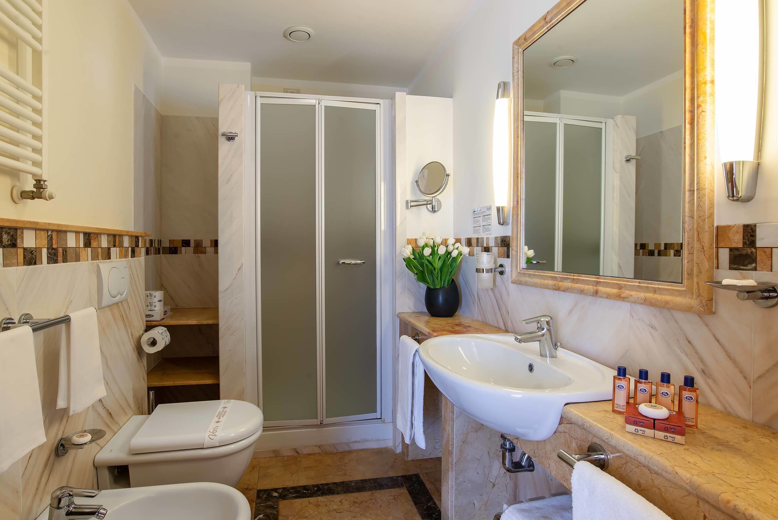 combined shower/bathtub, deep-soaking bathtub, hair dryer, bidet