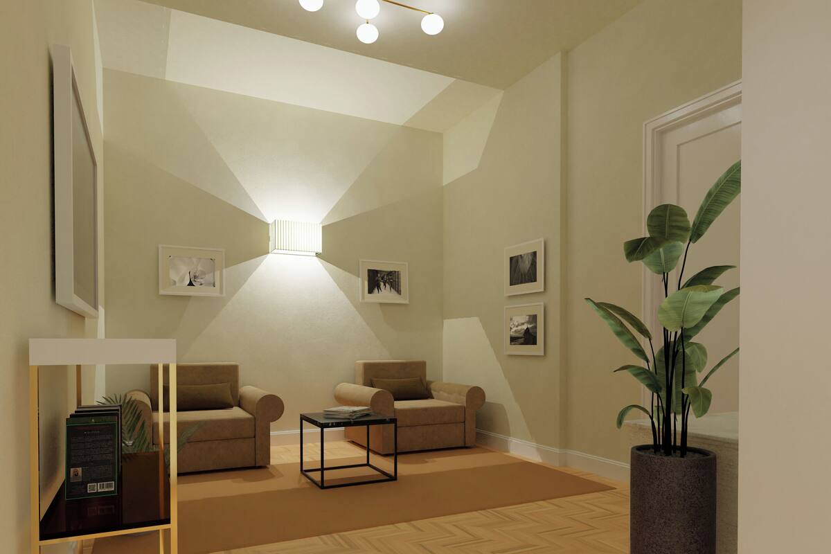 A modern living room with two sofas, a coffee table, and a large potted plant.