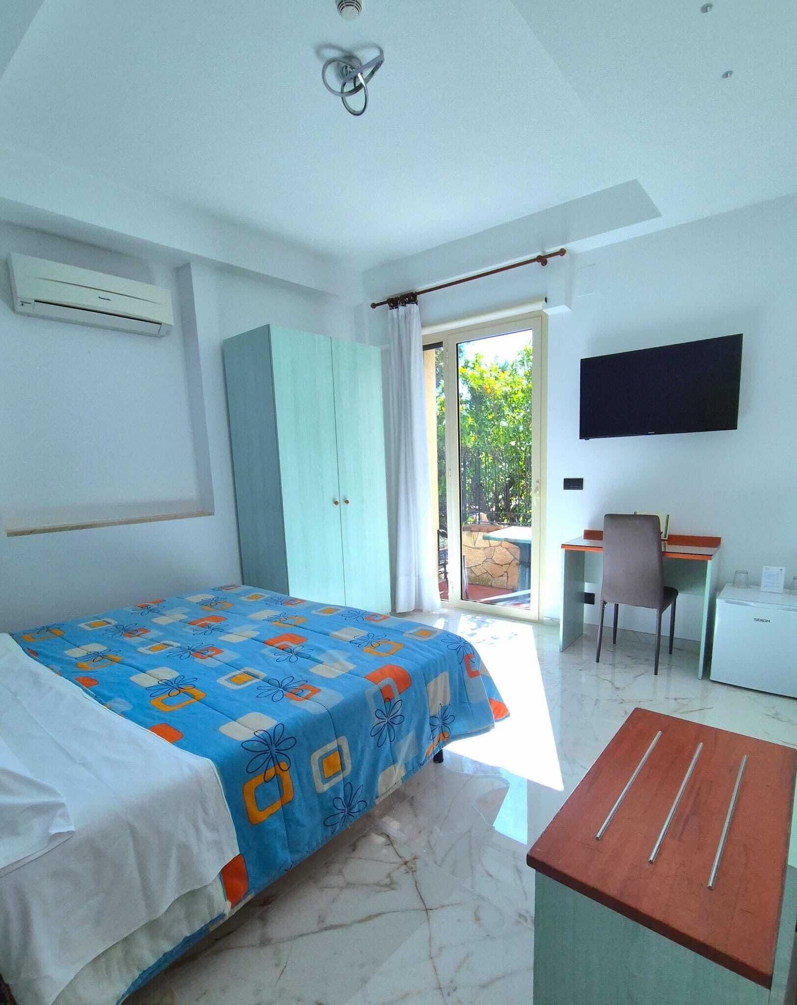 Standard Double Room | Minibar, in-room safe, desk, iron/ironing board