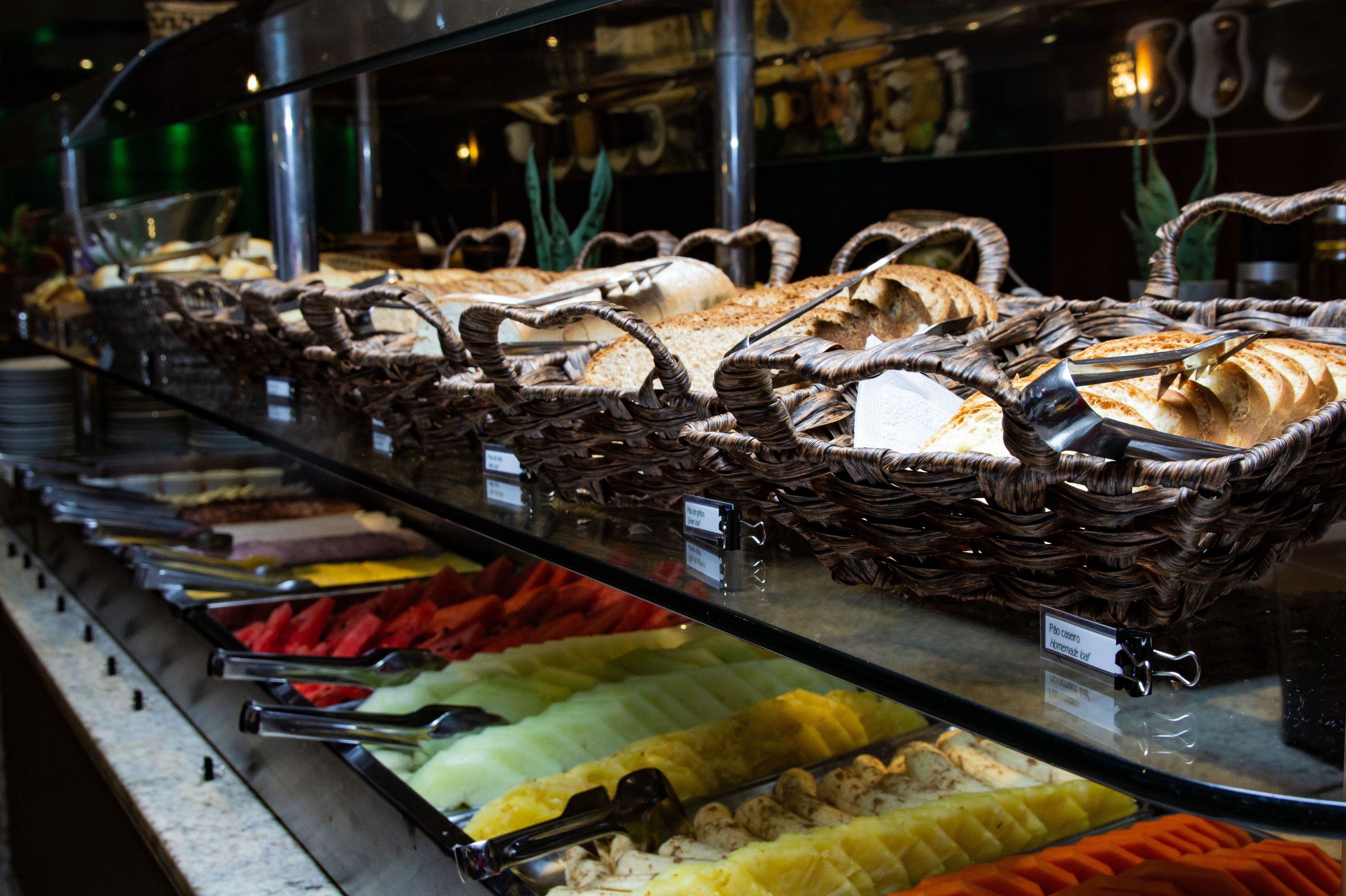 A buffet with various food items and serving utensils.
