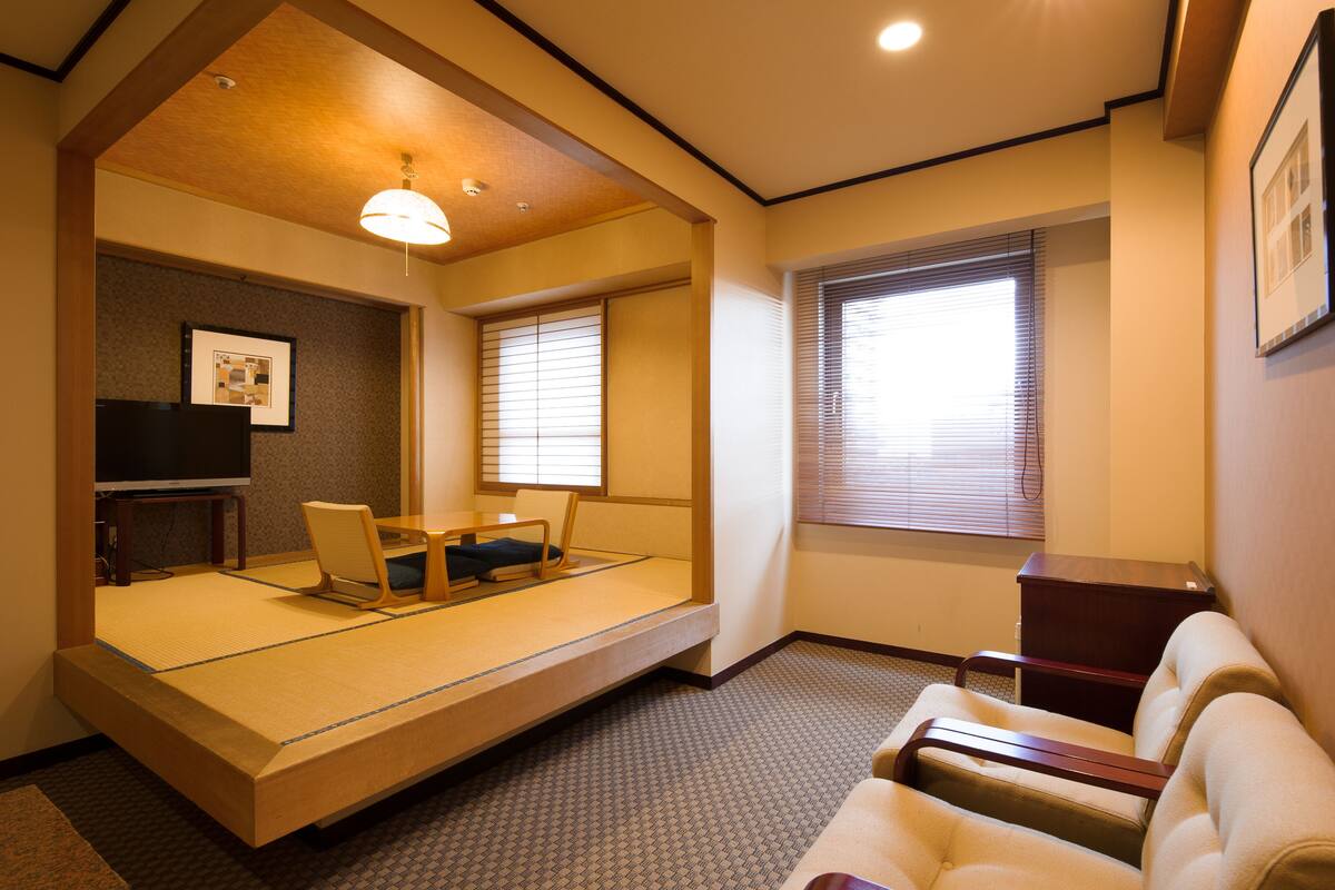Suite familiare, fumatori (Japanese style) | Area soggiorno | TV, film pay-per-view