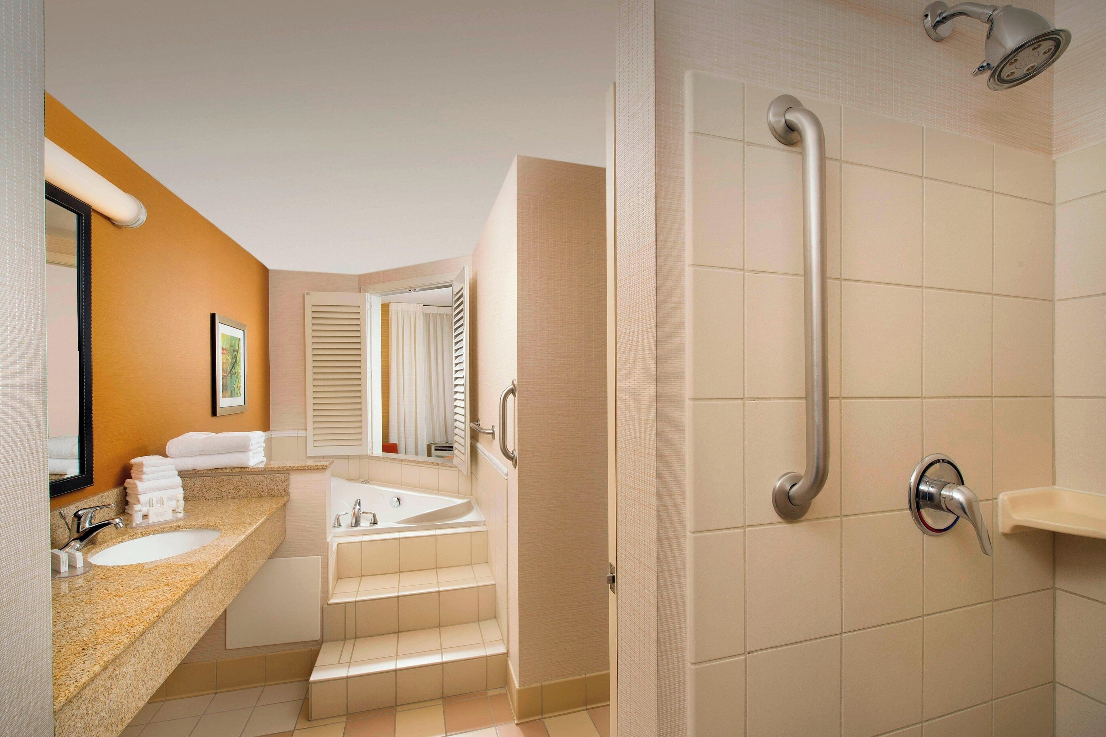 combined shower/bathtub, free toiletries, hair dryer, towels