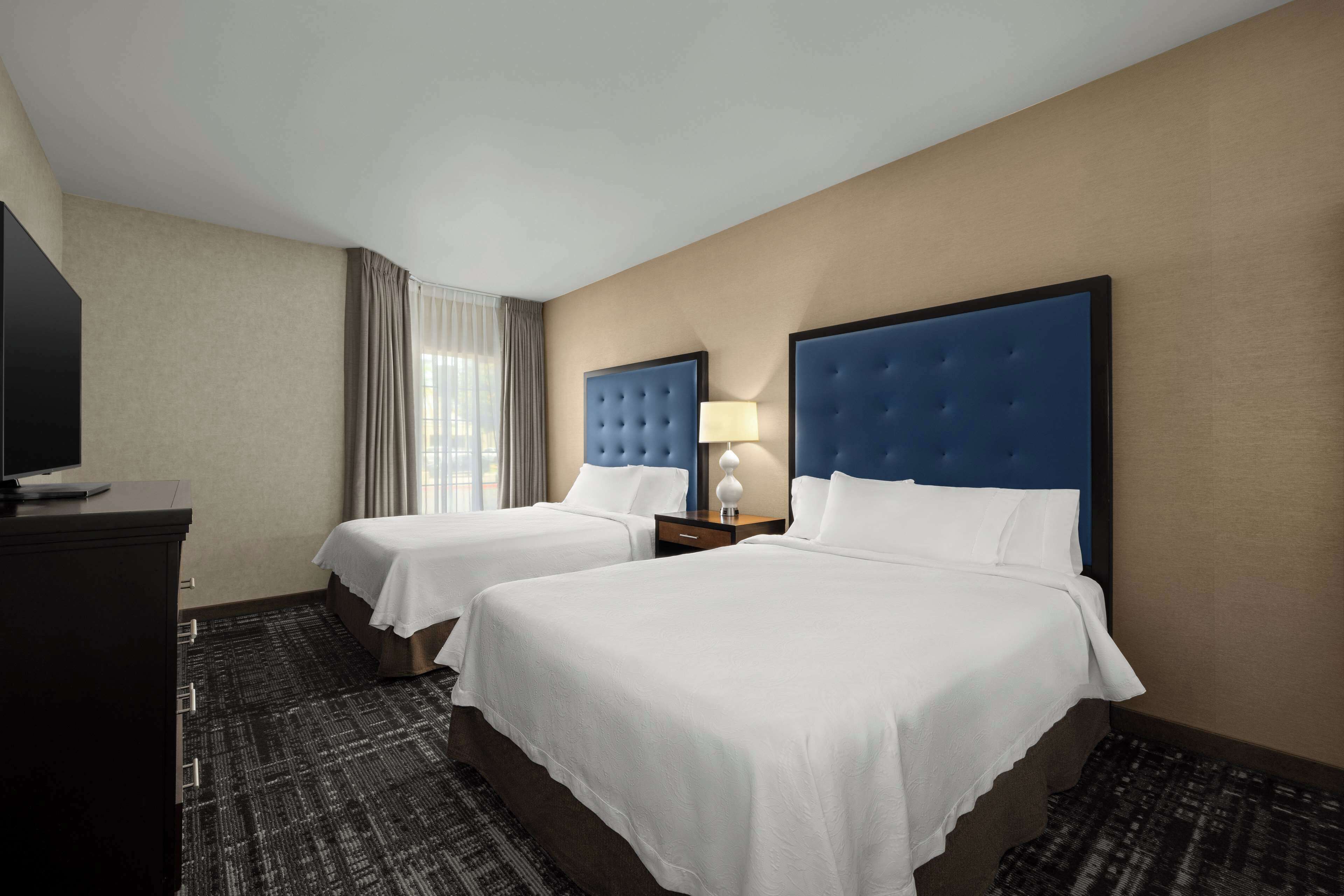 standard suite, 2 queen beds, non smoking | in-room safe, desk, iron/ironing board, free cots/infant beds