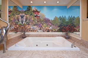 A large, white bathtub in a bathroom with a mural of a traditional Chinese landscape on the wall. - Holiday Inn Express & Suites Sharon-Hermitage by IHG (West Middlesex)