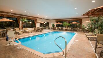 Indoor pool, open 7 AM to 11 PM, pool umbrellas, pool loungers