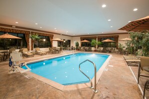 Indoor pool, open 7 AM to 11 PM, pool umbrellas, sun loungers