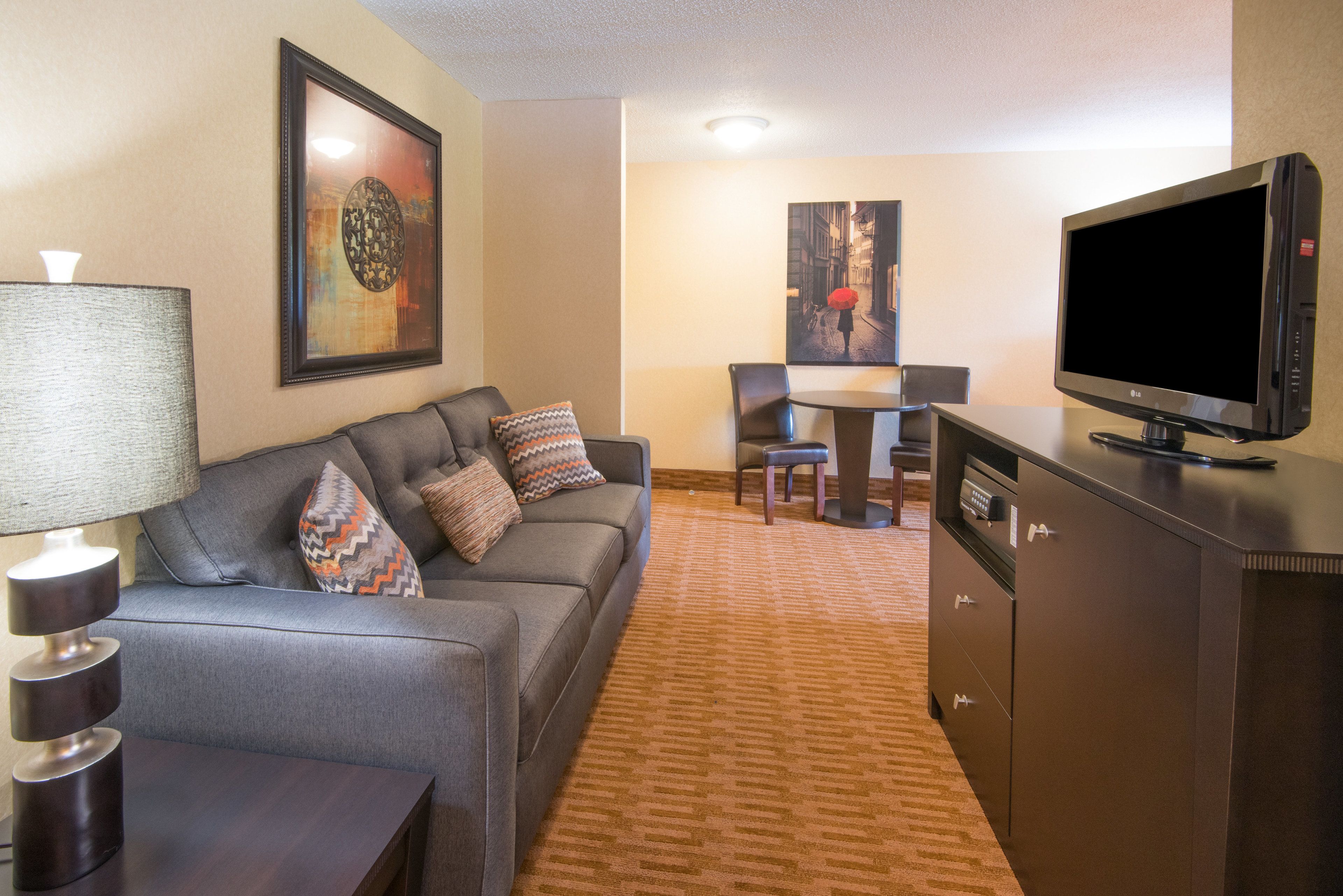 suite, 1 king bed, jetted tub | in-room safe, desk, blackout curtains, iron/ironing board