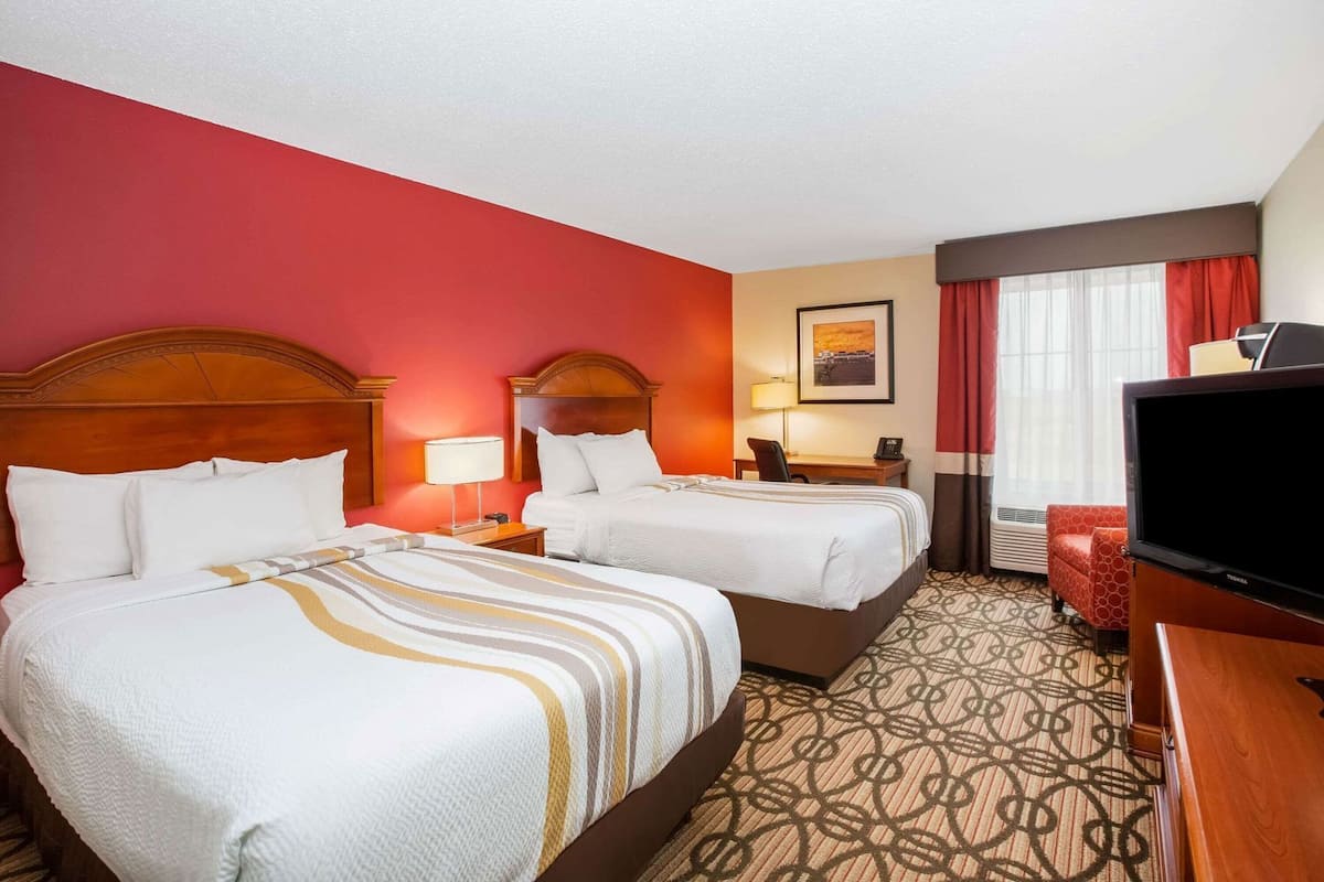 Premium bedding, pillow-top beds, desk, laptop workspace