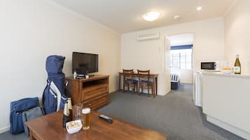 Apartment, 1 Bedroom | Living area | 32-inch LCD TV with satellite channels, TV, first-run movies
