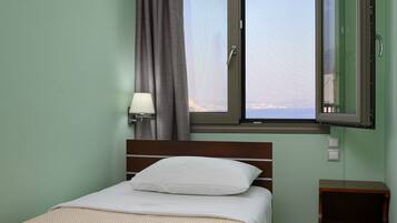 Triple Room, Sea View | Minibar, in-room safe, individually furnished, desk
