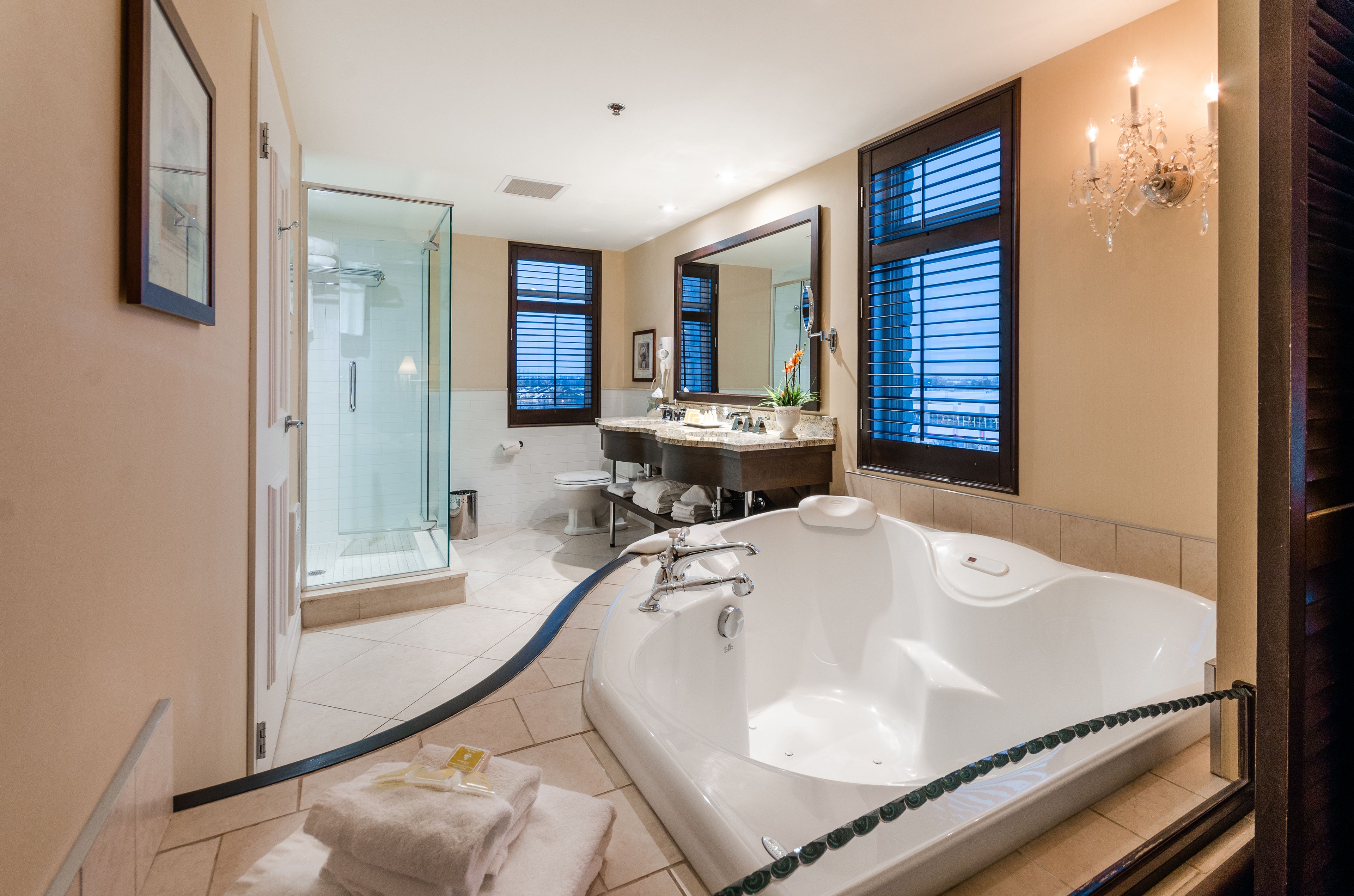 deluxe room, 1 king bed | bathroom | eco-friendly toiletries, hair dryer, towels