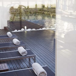 Indoor pool, pool umbrellas, pool loungers