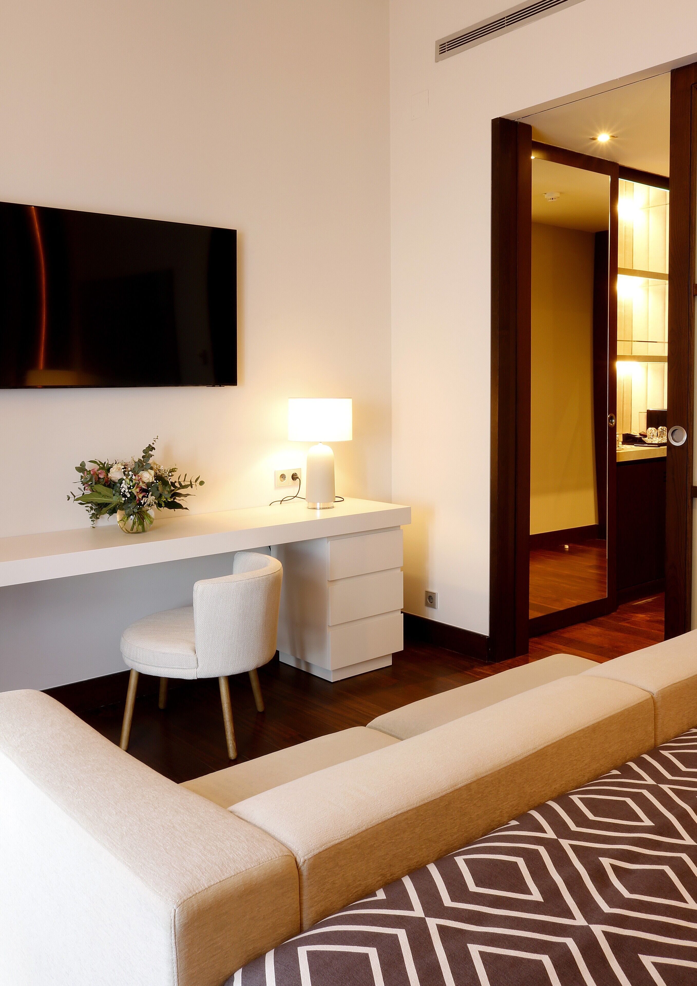 family room | 1 bedroom, minibar, in-room safe, desk