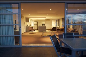 Three Bedroom Apartment | Living room | 42-inch LCD TV with cable channels, TV, iPod dock