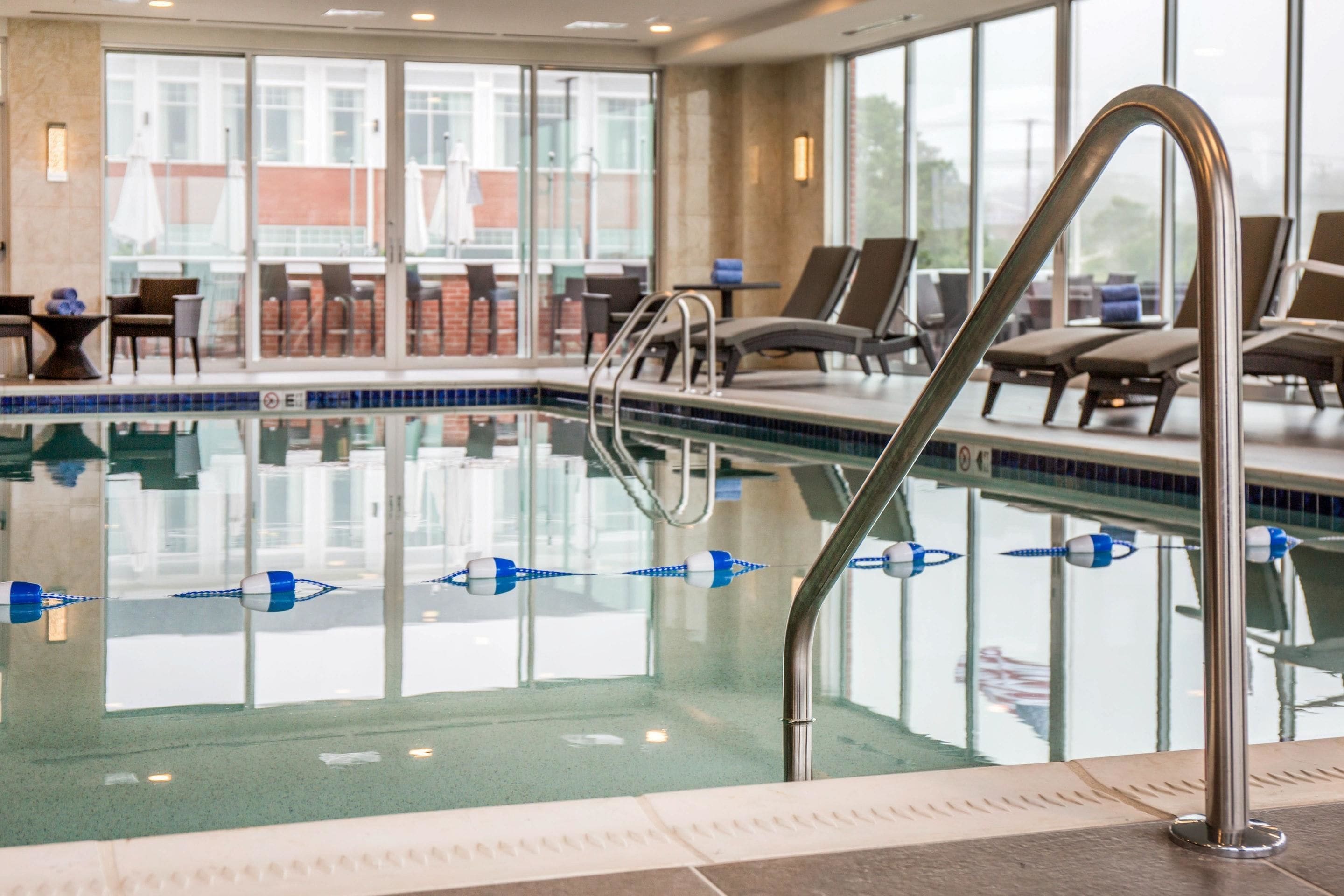 indoor pool, pool umbrellas, pool loungers