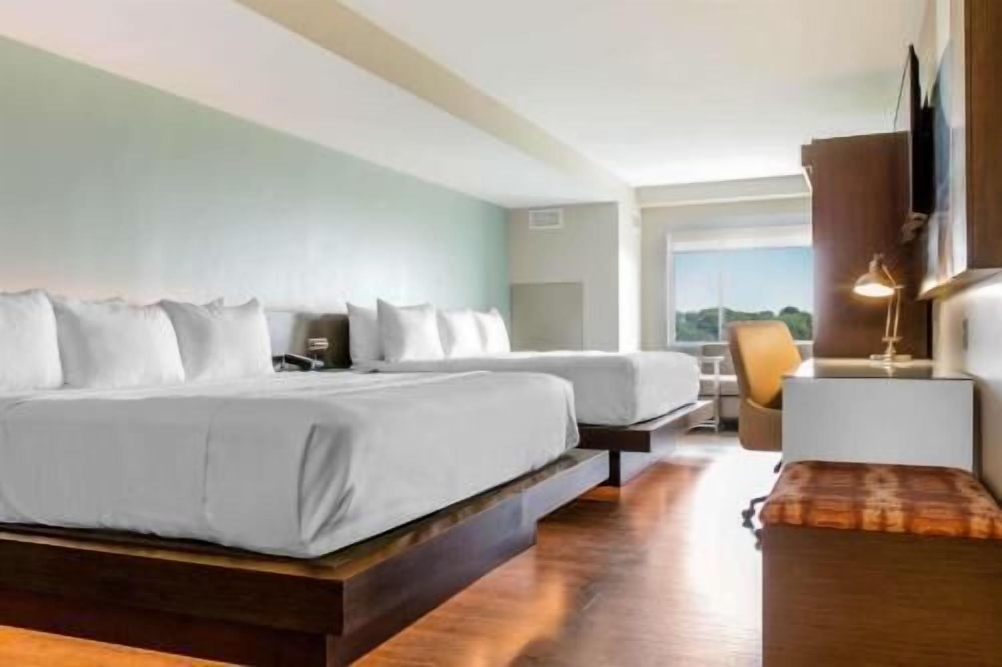 Premium bedding, pillow-top beds, desk, blackout curtains