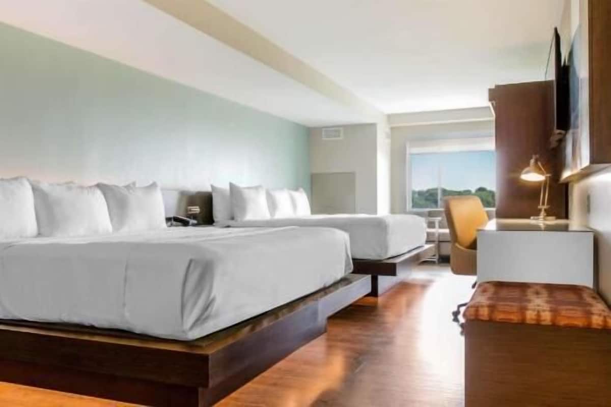 Premium bedding, pillow-top beds, desk, blackout curtains