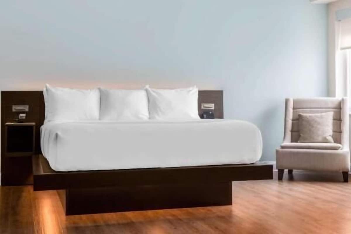 Premium bedding, pillow-top beds, desk, blackout curtains