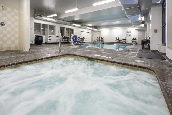 A spa area with a hot tub and seating area.