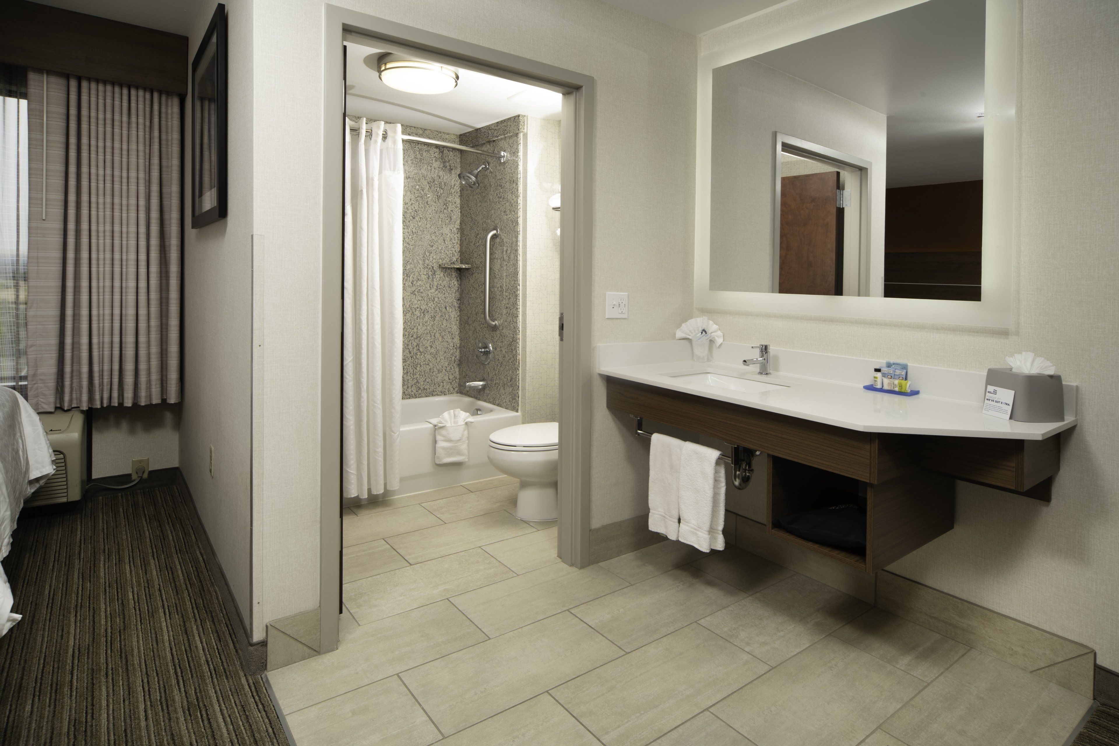 combined shower/bathtub, free toiletries, hair dryer, towels